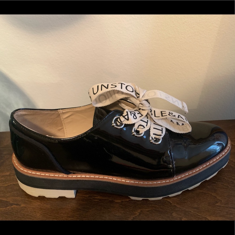 Black patent leather shoes with unique laces